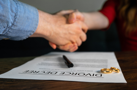Former husband and wife shake hands | Moreno Family Law, LLC